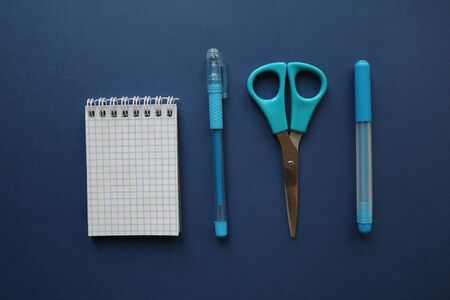 Stationery frame on white background top view. blue backgroundの写真素材