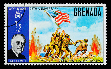 GRENADA - CIRCA 1970: A postage stamp printed in Grenada showing Franklin Roosevelt & Raising The US Flag On Iwo Jima, circa 1970のeditorial素材