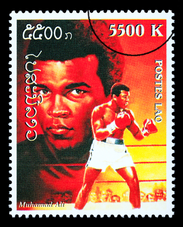 LAOS - CIRCA 1999: A postage stamp printed in Laos showing Muhammad; Ali, circa 1999のeditorial素材