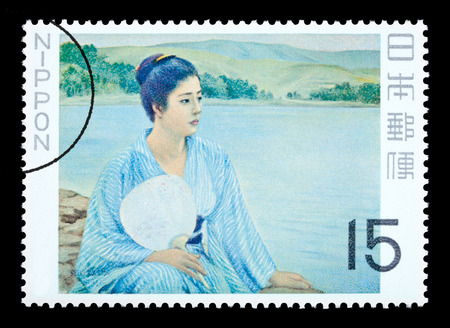 JAPAN - CIRCA 1980: A postage stamp printed in Japan showing a painting of a Japanese woman, circa 1980のeditorial素材