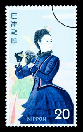 JAPAN - CIRCA 1970: A postage stamp printed in Japan showing a painting of a Japanese woman, circa 1970のeditorial素材