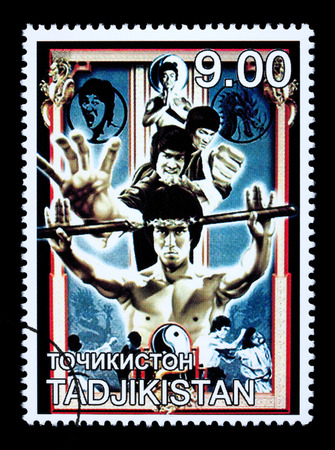 TADJIKISTAN - CIRCA 2000: A postage stamp printed in Tadjikistan showing Bruce Lee, circa 2000のeditorial素材