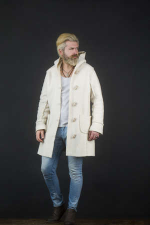 Elegant handsome man in stylish coat. Full length portrait of a young fashion male.の写真素材
