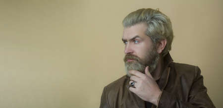Young handsome man, hipster in leather jacket.