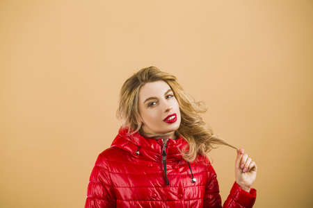 Fashion portrait of young beautiful woman with hairstyle. Girl with glamour makeup looking at...
