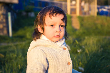 Handsome Young Boy. Portrait of cute little boy child in the park.