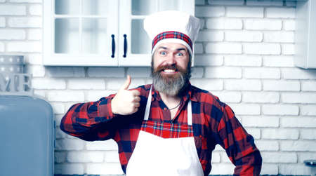 Serious satisfied bearded chef, cook or baker gesturing excellent.の写真素材