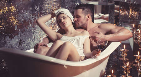 Loving couple having sex in the bathroom.の写真素材