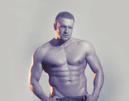 Sexy naked torso, six pack abs. Male flexing his muscles. Sport workout bodybuilding conceptの写真素材