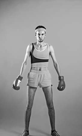 Comic weak fighter with red sport boxing gloves.の写真素材