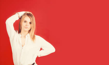Beautiful young blonde girl with trendy accessories posing in studio. Perfect make-up.の写真素材