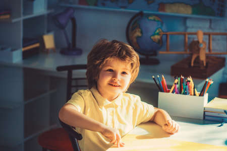 Funny happy children draw in the home.の写真素材