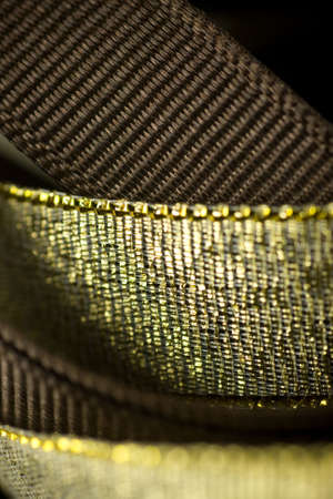 Ribbons in gold and brown color, close up shot with selective focus.の写真素材