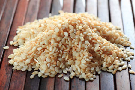 Sesame on wood background