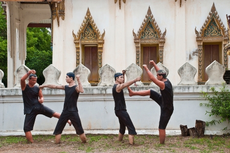 a model sculpts Thai ancient soldier show the craftsmanship fights stay beside temple wallのeditorial素材