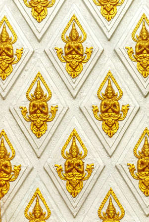 temple white wall with angel color golden pictureの写真素材