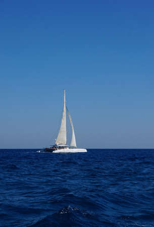 White boat with sails in the Mediterranean                   