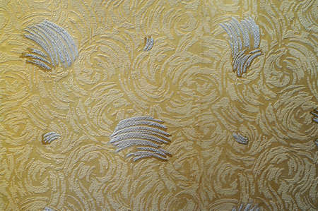 Texture of pale yellow paper wallpaper with abstract pattern                               の写真素材