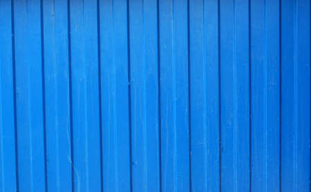 Texture of corrugated metal fence painted with blue paint                       の写真素材