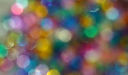 Abstract background of multicolored spots bokeh                           の写真素材