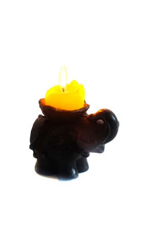   Side elephant candlestick with burning candle                             の写真素材