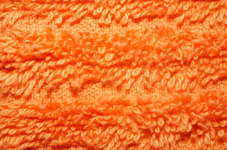 Texture of bright orange terry towels very closeup                               の写真素材