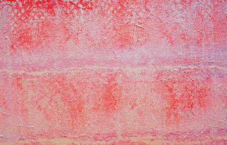 Plastered red-purple wall as an abstract backgroundの写真素材