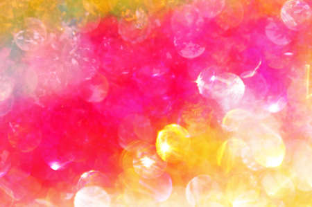 Bright multicolored (yellow and pink) spots abstract backgroundの写真素材