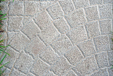 Gray stone tiles on the garden path as backgroundの写真素材