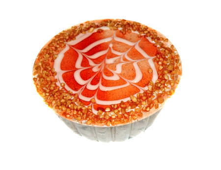 Cake decorated with red berry jelly and crushed nuts isolatedの写真素材