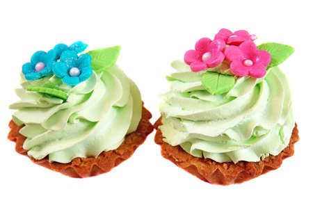 Cake basket decorated with light green cream and pink flowers from masticの写真素材
