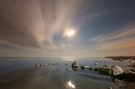 Summer night moon landscape of Ladoga lake, Leningrad region, Russiaの写真素材