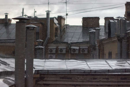 Old city roofs during heavy rain, Saint-Petersburg, Russiaの写真素材