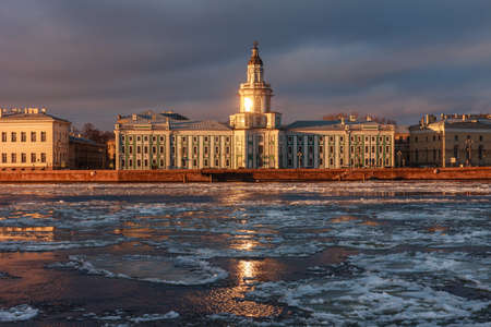 Kunstkamera during sunset in Saint-Petersburg, Russia, Neva river with floating iceの写真素材