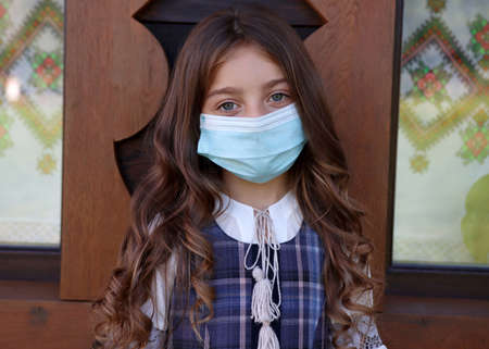 Cute little girl with protective maskの写真素材