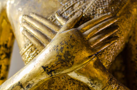 Hand on chest buddha statue