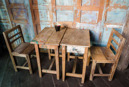 vintage style chair and table in the cafeの写真素材