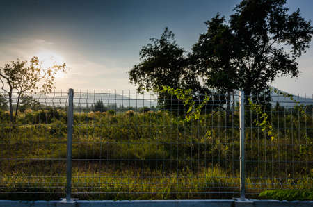 sun set over the wire fence at Hua hinの写真素材