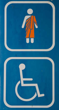 wheelchair and monk restroom sign