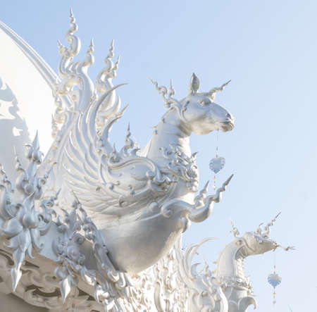 horse chinese zodiac at white temple, Wat Rong Khun, Chiang Rai, Thailandの写真素材