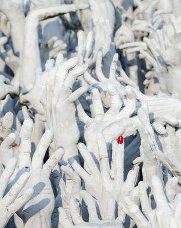 red nail and white hand form hell, Wat Rong Khun, Chiang Rai, Thailandのeditorial素材