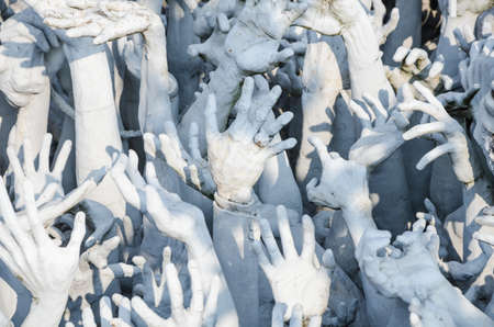 white hand form hell, Wat Rong Khun, Chiang Rai, Thailandのeditorial素材