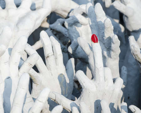 red nail and white hand form hell, Wat Rong Khun, Chiang Rai, Thailandのeditorial素材