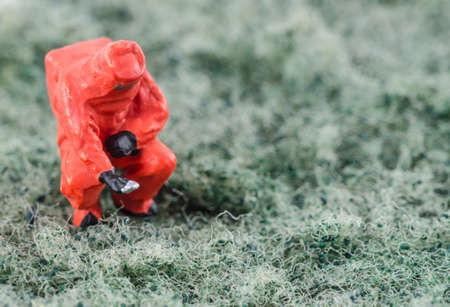 miniature scientist checking bacterial on the cleaning padの写真素材