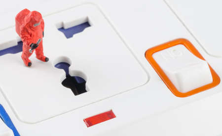 miniature electrician checking power stripの写真素材