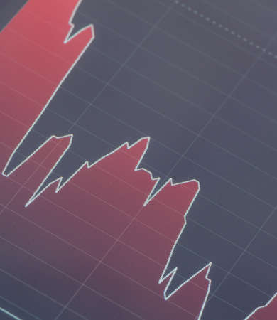 falling red stock graph on the tabletの写真素材