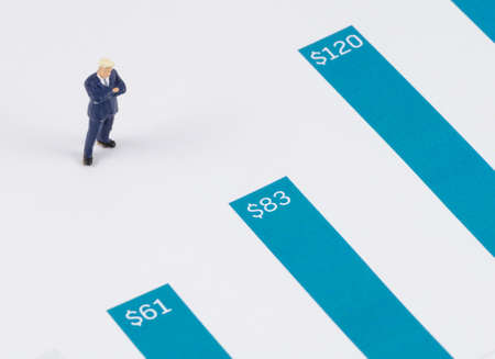 miniature businessman standing on the growth graphの写真素材