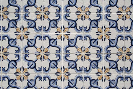 Background of traditional blue, white and gold portuguese tiles 