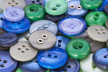 Closeup image of green and blue sewing buttonsの写真素材