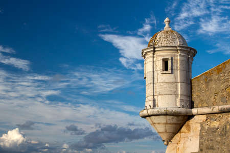 Tower of the ancient fort in Lagos, Algarve, Portugal, against a blue skyの写真素材